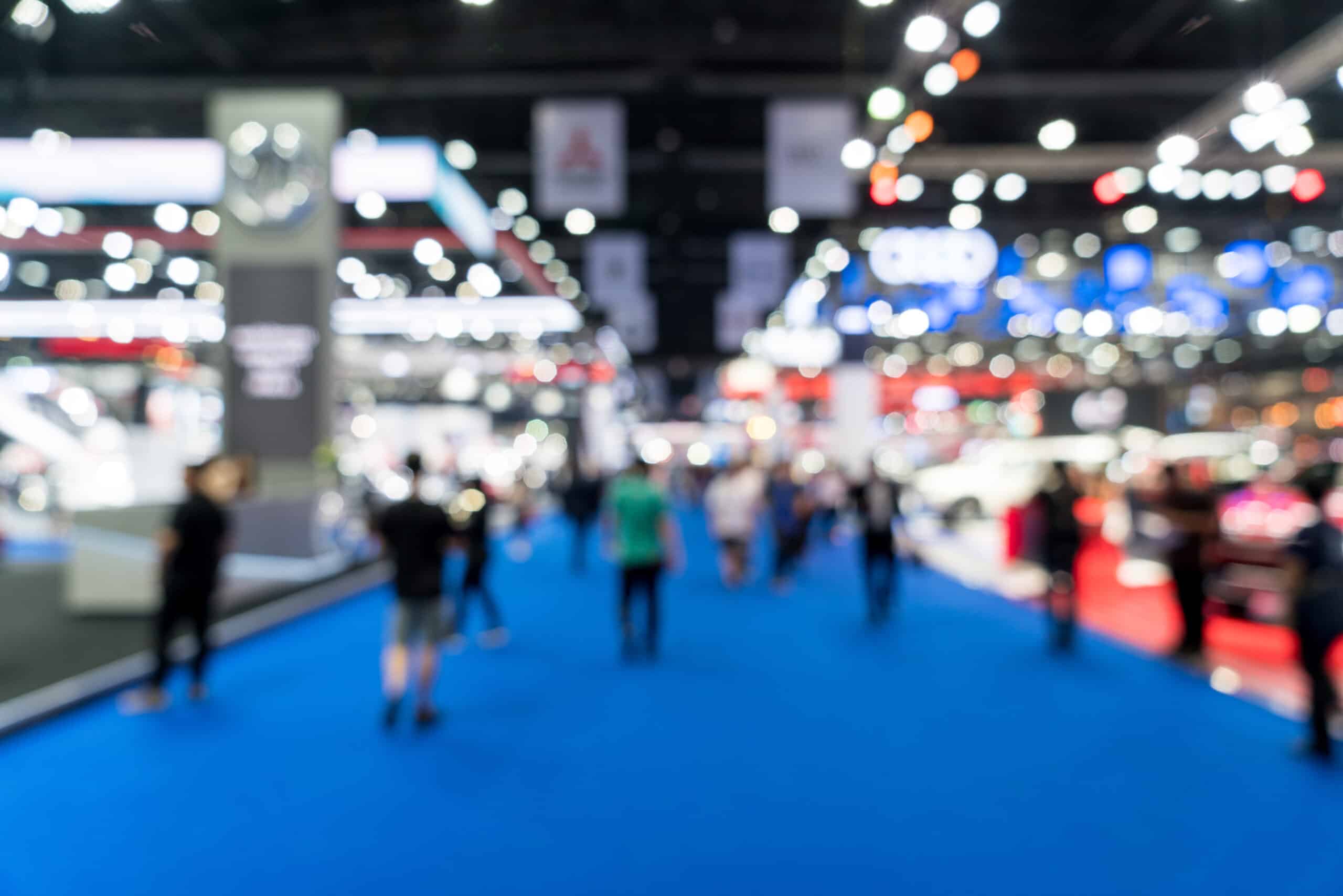 Blur, defocused background of public exhibition hall. Business tradeshow, job fair, or stock market. Organization or company event, commercial trading, or shopping mall marketing advertisement concept